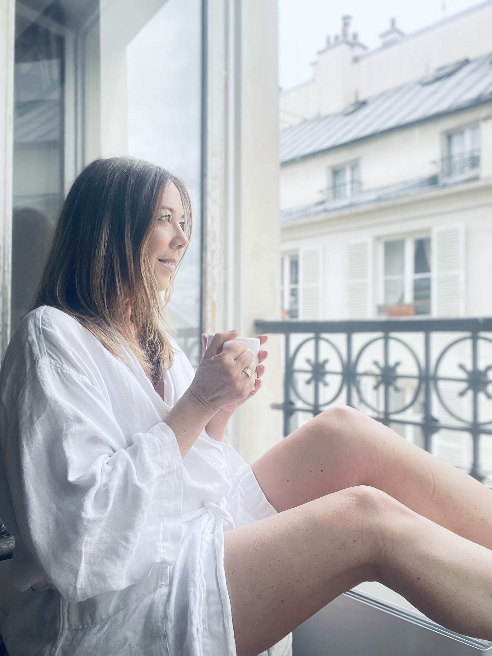 woman looking out the window