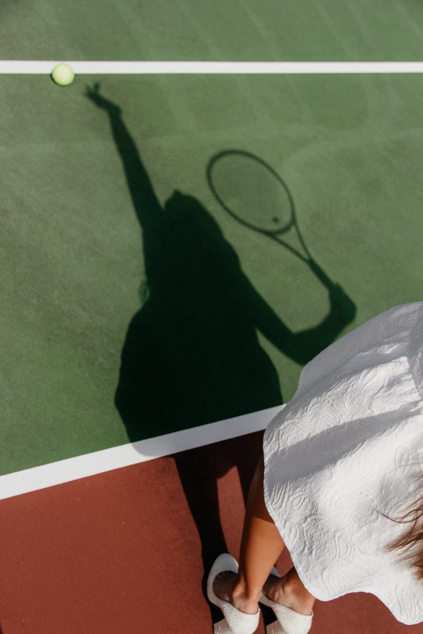 shadow of woman playing tennis