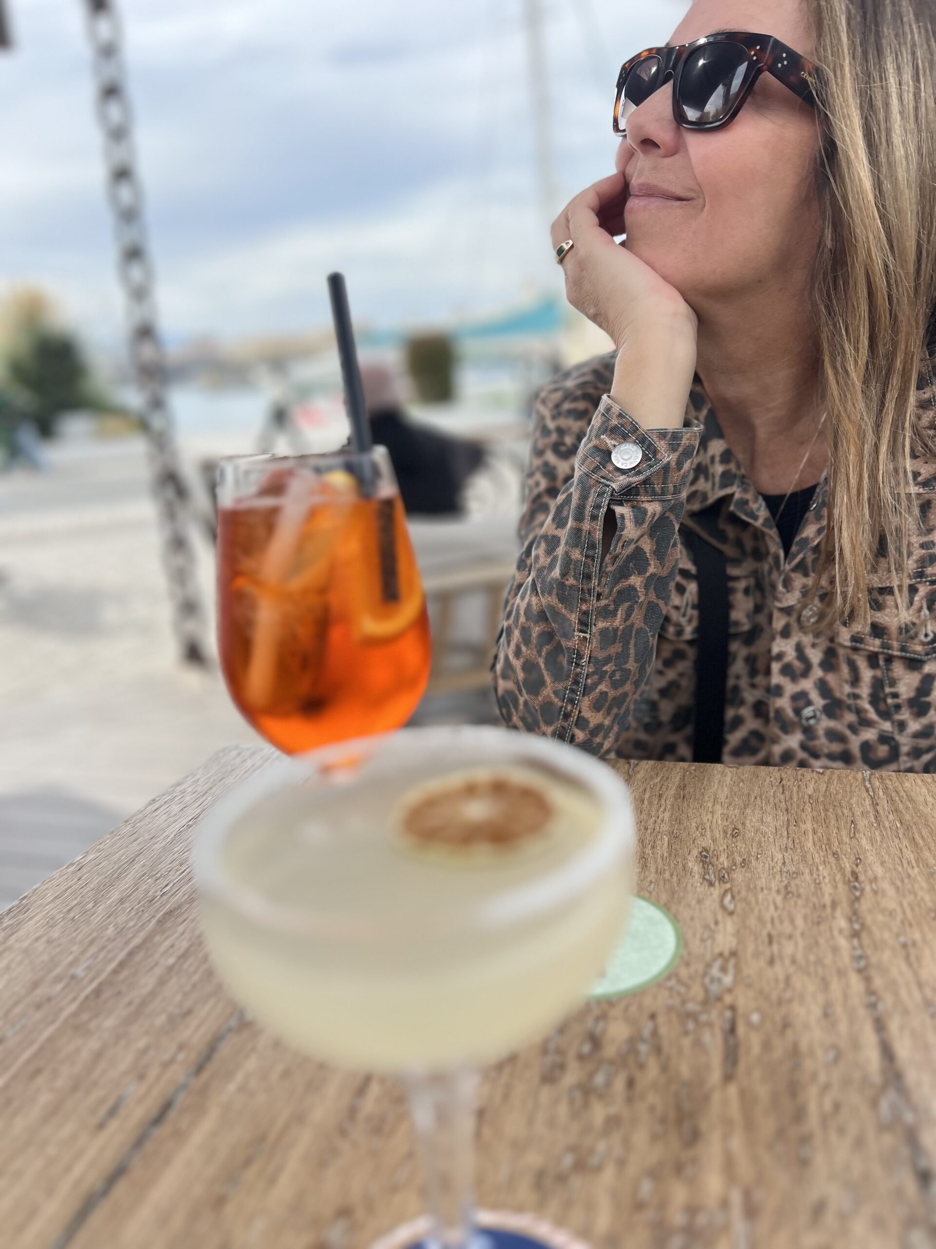 Woman in Malaga with Aperol spritz